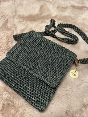 The Sak Dark Green Woven Crossbody Bag with Gold Charm